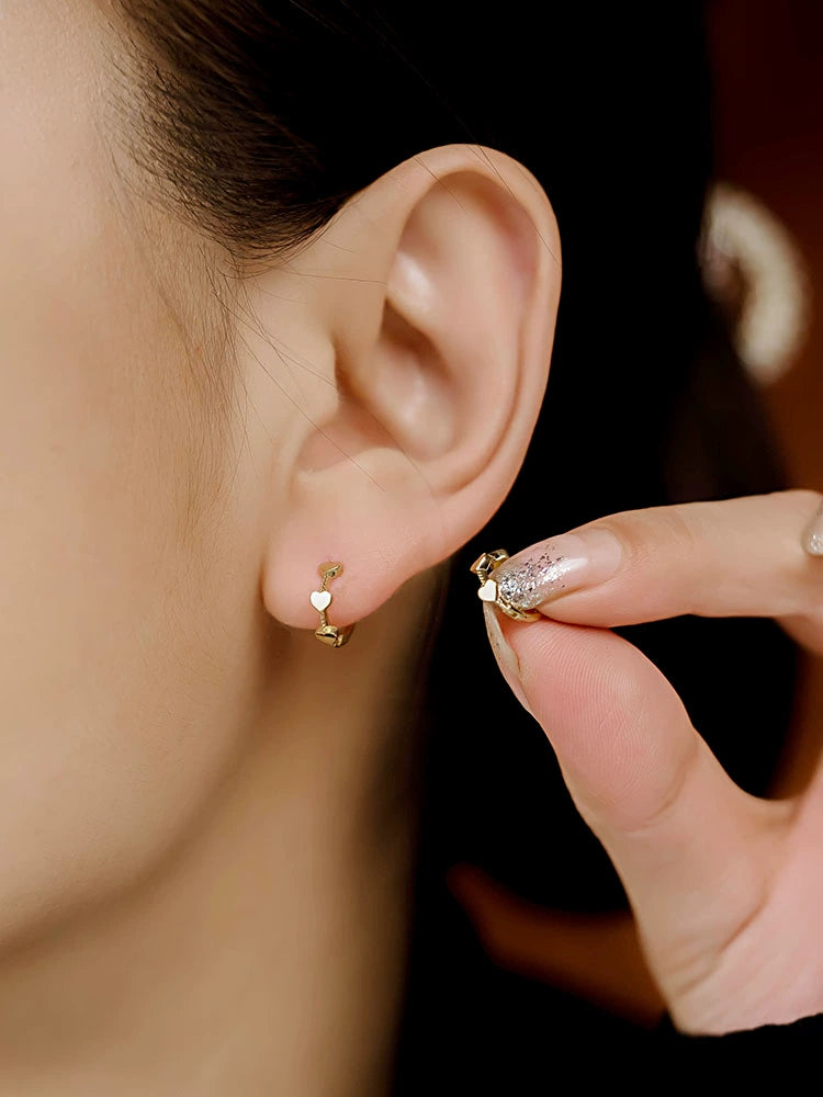 Three Hearts Twist Huggie Hoops