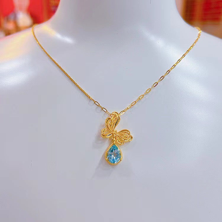 Bow Wrapped Tear Charm Necklace