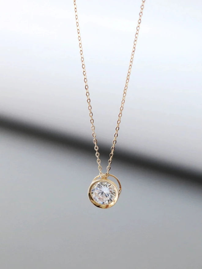 Caged Solitaire Wheel Charm Necklace